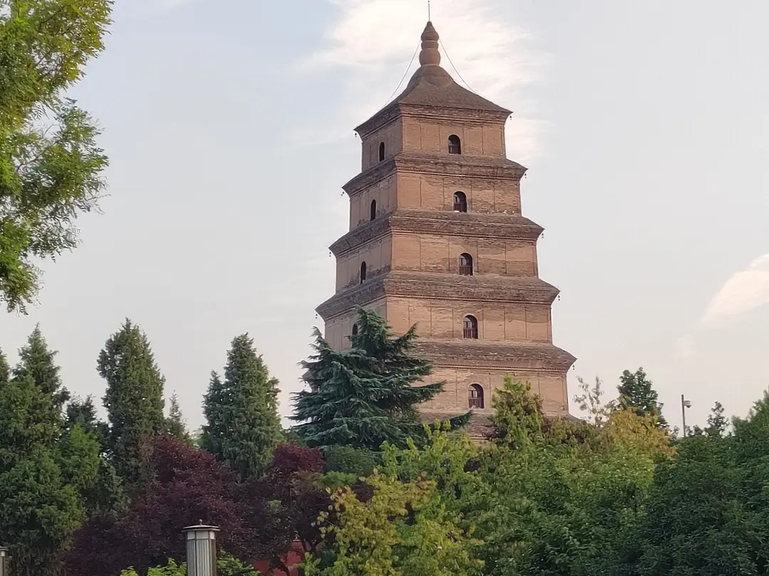 Upper stories of the square brick Giant Wild Goose Pagoda against a blue sky