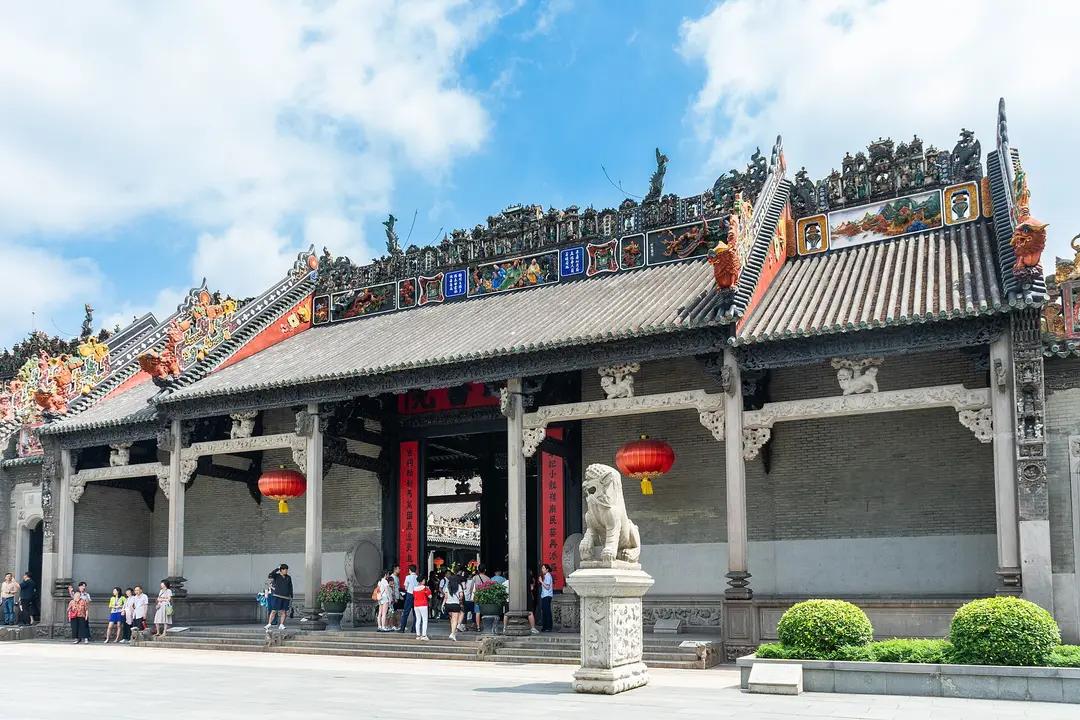 The front of the Chen Clan Ancestral Hall, its roof ridge crowded with colorful ceramic figures