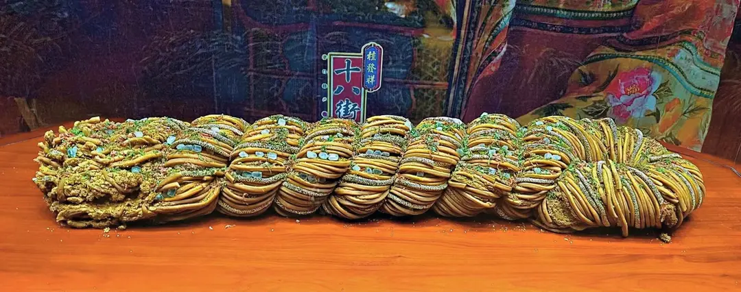 Metre-long twisted fried dough stick in a Guifaxiang display