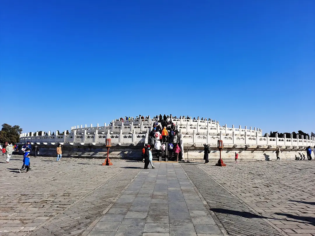 The white marble terraces of the Circular Mound Altar under a clear blue sky
