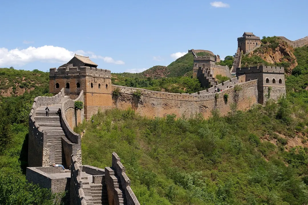 Watchtowers of the Great Wall along a ridge, with steps leading up from the foreground