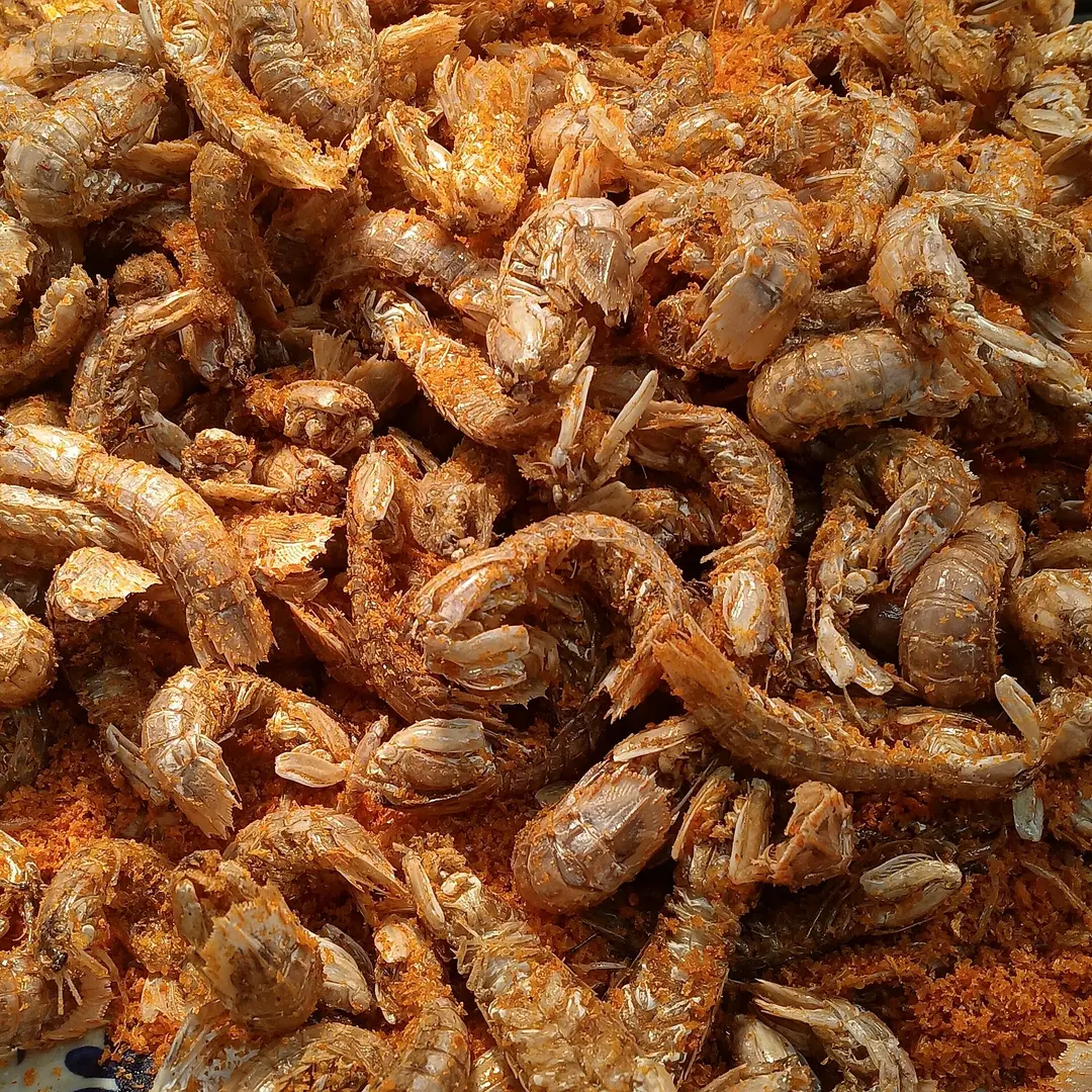 A heap of fried mantis shrimp coated in salt, pepper and fried garlic